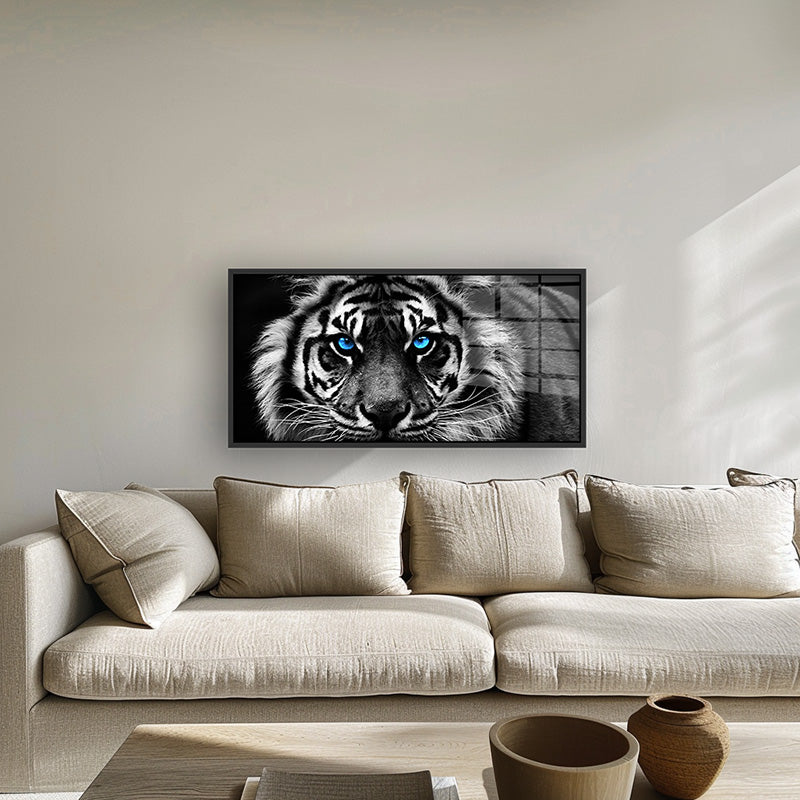 Tiger with Blue Eyes painting in a black frame inside